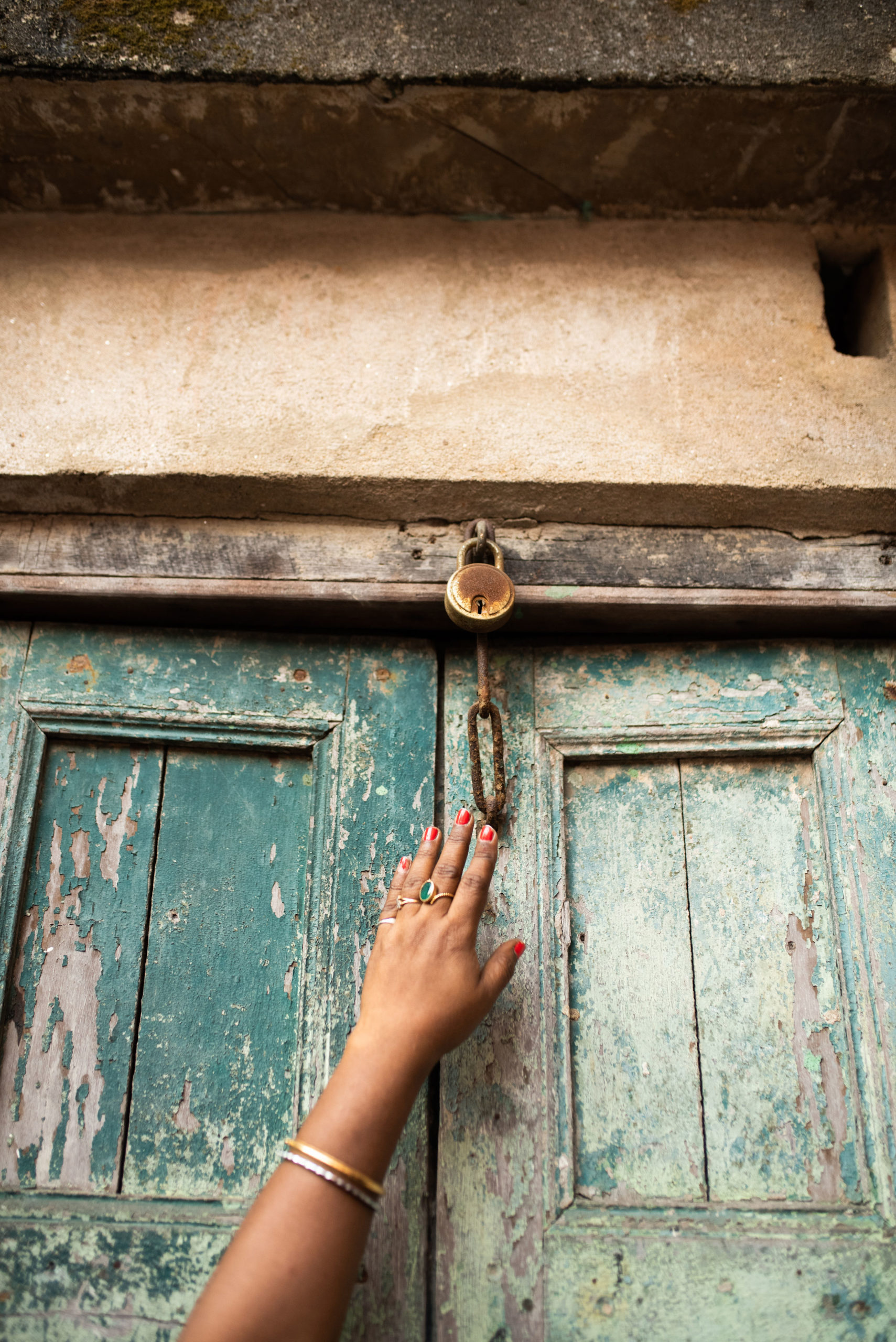 Hand touching lock by Sarah Annay
