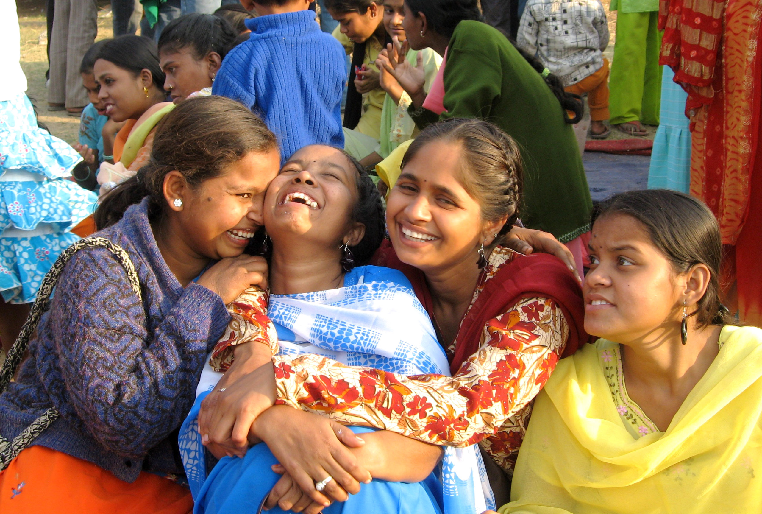 Indian women laughing in beautiful saris