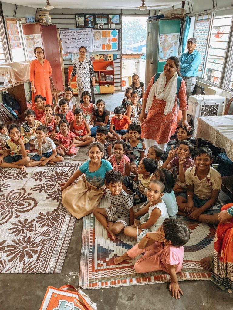 Group of kids and teachers in a classroom at Red Light Resource Center in India