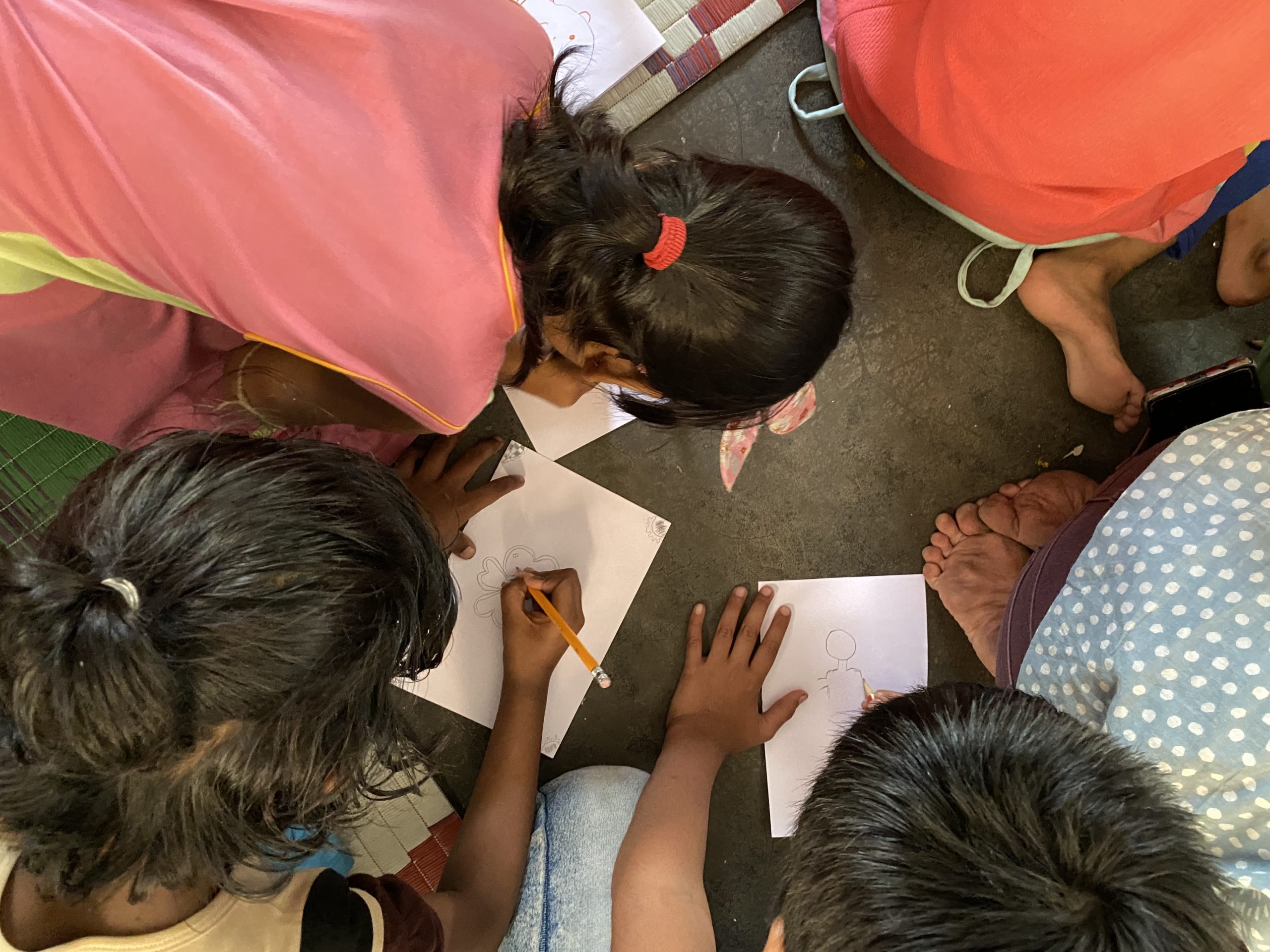 Indian children in shelter making crafts